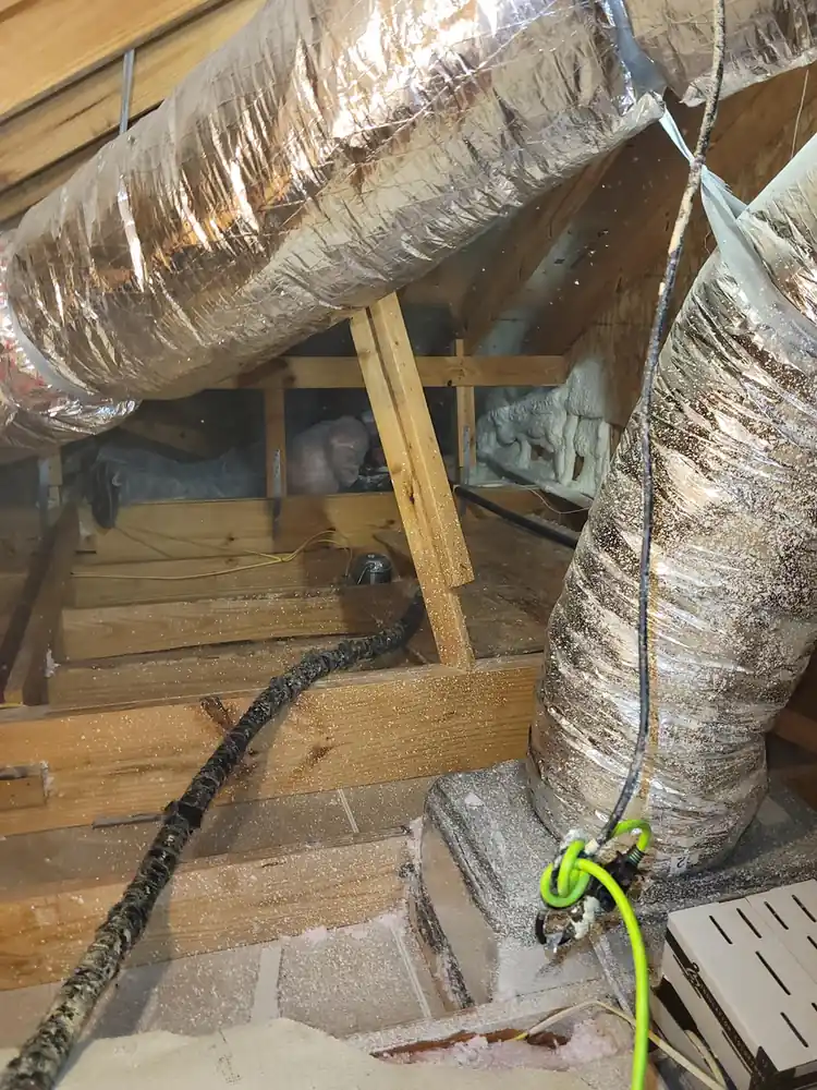 Air sealing and spray foam around attic ductwork in Greater Houston