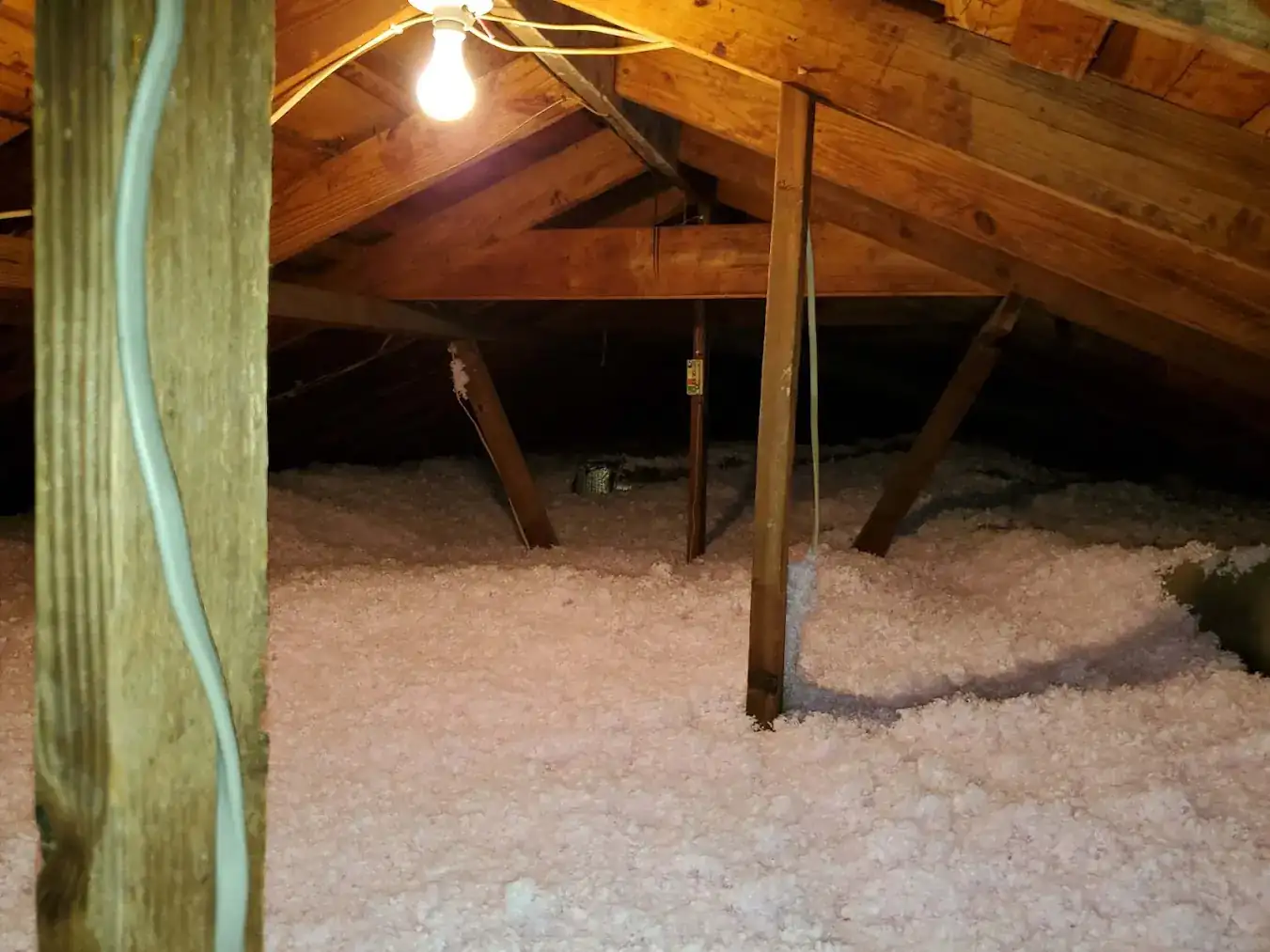 Spray foam applied along attic rafters in Baytown TX