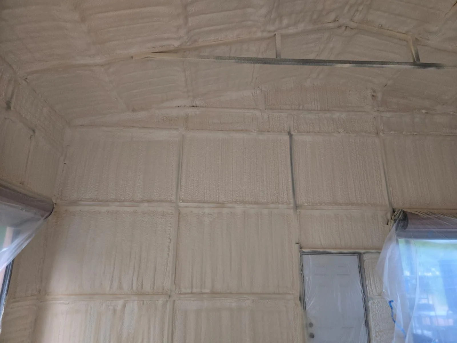 Commercial spray foam insulation project inside a metal building