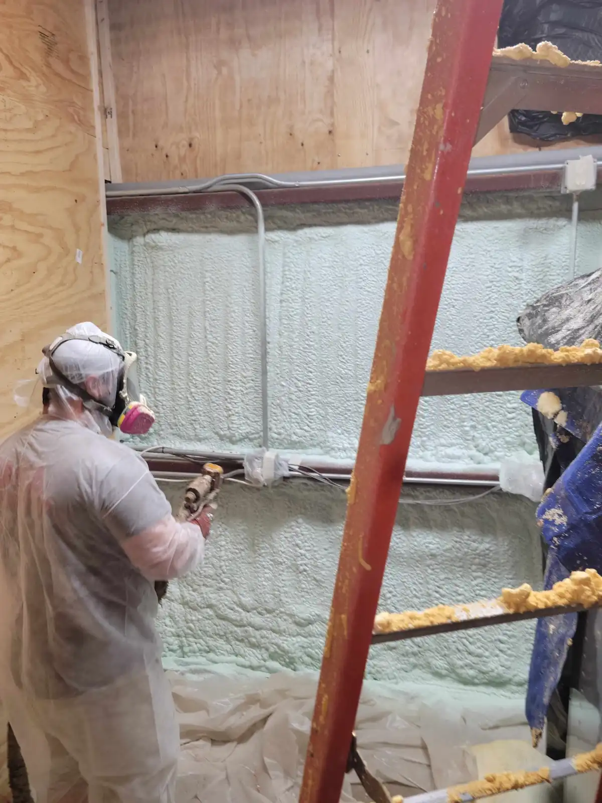 Commercial spray foam insulation application using mobile scaffolding in Houston